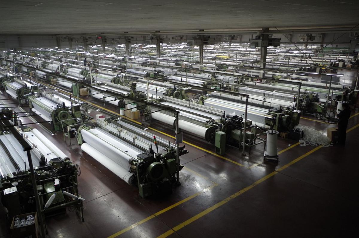 Rows of monofilament mesh looms in the MAISHI weaving hall